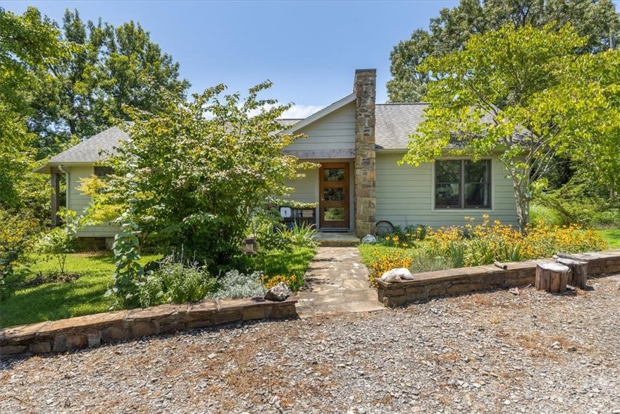 This incredible homestead features A House + Guest House totaling 3,008 sq ft ($249.34 s.f.) & breathtaking views of Mt. Magazine. The property boasts 80 acres of private land—perfect for your friends, relatives, parents, children & grandchildren. The main house is full of charm with 3 bedrooms, 2 bathrooms, an open floor plan, original log cabin oak beams, Anderson windows/doors & bamboo flooring. The kitchen includes custom hickory cabinets & granite countertops, the covered porches are perfect for relaxing. The 1,500 sq ft Dog Trot–style guest house offers 2 bedrooms, 2.5 bathrooms, a sauna, soapstone woodburning stove & wet bar. Outside is a large deck with spectacular views of Mt. Magazine, complete with a hot tub & a refreshing pool to cool off on hot summer days. In addition to a wide variety of flowers, there are several outbuildings: a 42' x 40' metal Quonset hut ideal for a shop area, 14' x 8' workshop with HVAC, cook shack & 12' x 8' garden shed. Seller may consider selling homes & acreage separately.