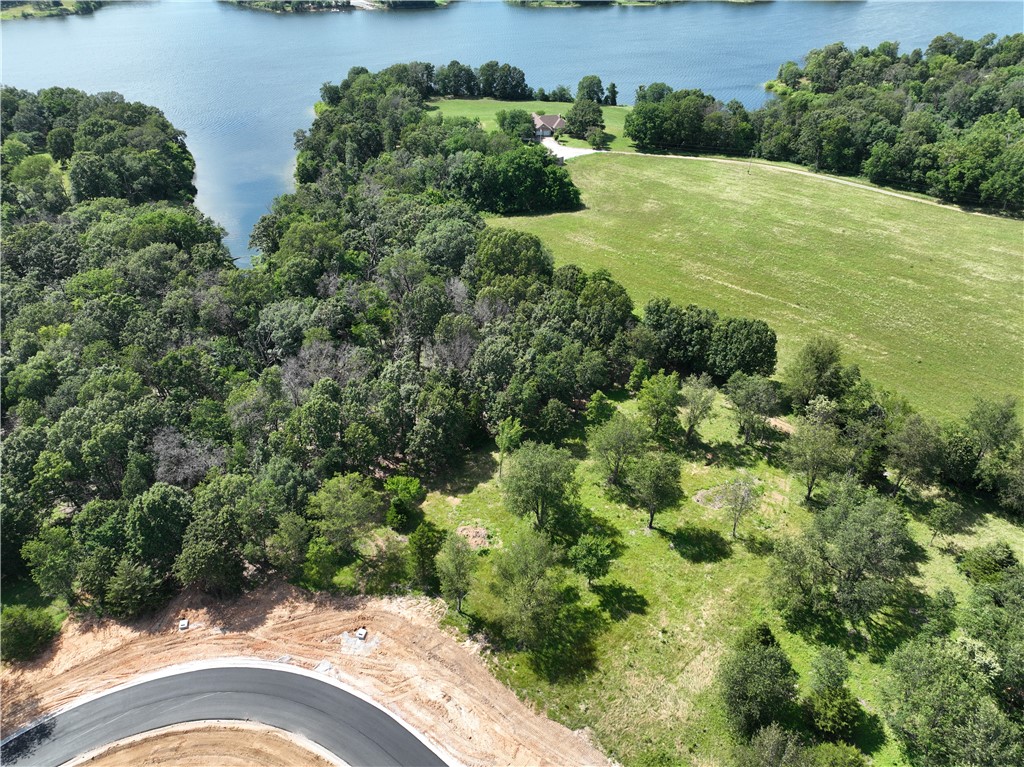 Discover the perfect setting for your dream home on these breathtaking estate lots! With paved roads, city water, and a 2,200 SF minimum, these private homesites offer a blend of luxury and tranquility. Enjoy stunning views in a prime location, providing both seclusion and convenience. Don’t miss this rare opportunity to build in a truly exceptional setting. In total there are 27 lots. Subject to final plat