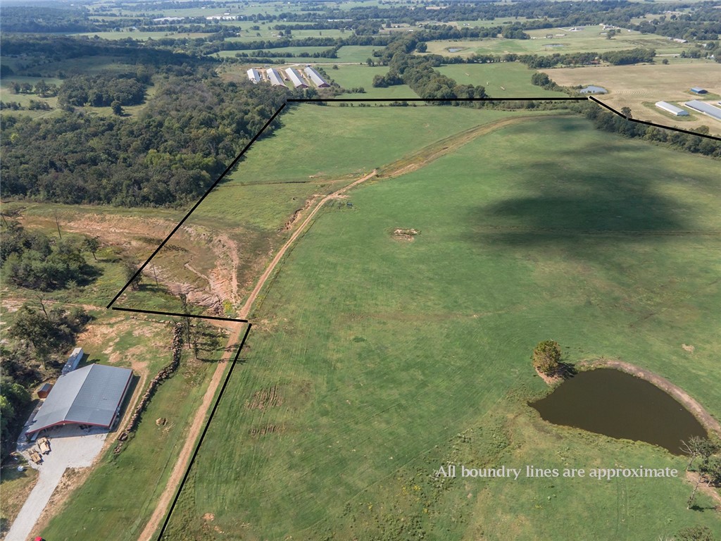 Great cattle farm! 80.73 acres of bottom land with a small portion of woods. There is a spring-fed pond in the middle of the farm. This could also be a great hunting location. There is an ample supply of top soil if a person needed to mine some of it. There is a great view on the upper portion of the property.