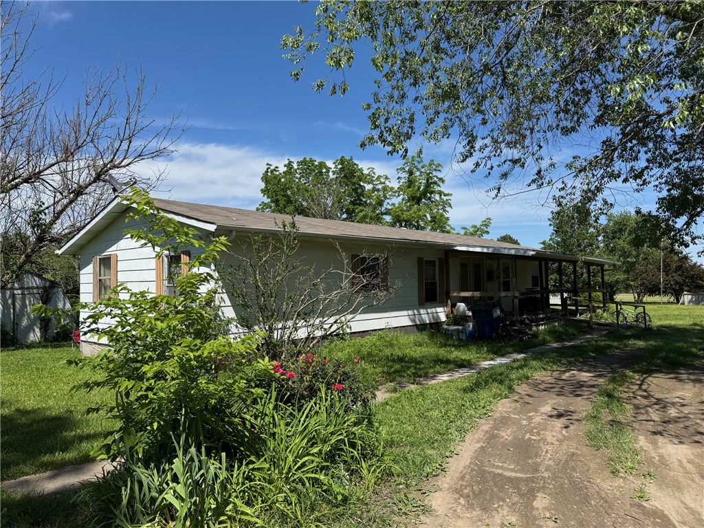 Two homes selling AS IS on 4.5 acres. One is a home built around a mobile home with 3 bd, 1 ba. The other is a single-wide mobile home with 3 bd 2 ba. Both have separate meters, septic and covered deck. Both will need major remodeling. Renters living in both. Small cave in back of property. All numbers approximate!