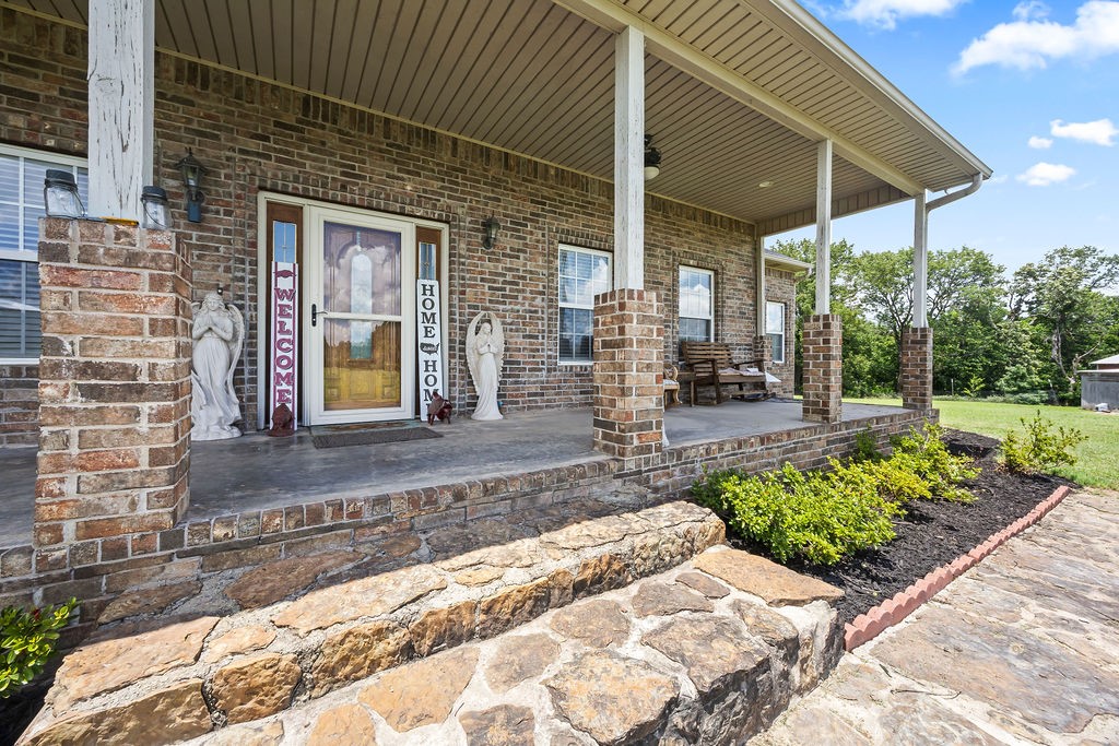 Welcome to your slice of country paradiseājust minutes from downtown Prairie Grove! Enjoy peaceful living on spacious land with all the comforts of home. The generous layout features a fully equipped kitchen with granite island, double ovens, full-size fridge, and ample storage. A large bonus room offers space for a home theater, office, or studio. Major recent upgrades include: new five-ton HVAC, water filtration system, new pool liner, new pool deck, new roof. Step outside to your private oasis with a sparkling pool perfect for summer fun. The barn/shop, while needing some tlc, offers room for hobbies, storage, or business use. Additional utility hookups on the far end of the land are ideal for future expansion-rental or workshop. The flat, fertile property is dotted with mature apple, peach, and cherry trees and offers great potential for farming, gardening, or development. Pre-qualification letter or proof of funds required with offer. Indoor cats are on-site and must stay in their designated room.