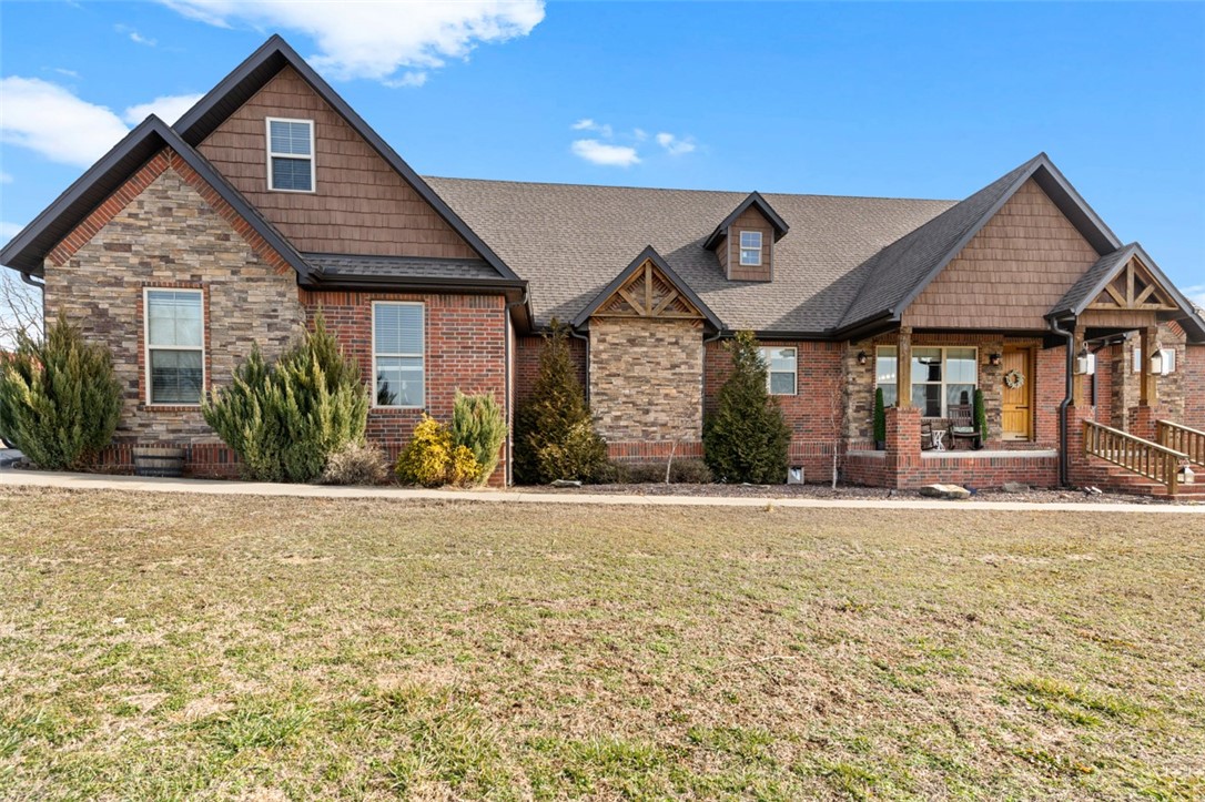 NOTHING like this in NWA- see it all in the virtual tour! Your own private resort stands on little under 7 flat acres. Fence line has a treehouse & a custom sledding/slip-n-slide hill. Enjoy a game of Pickleball on your own fenced court or play golf on your 2-hole par 3 course. Open floor concept is perfect for entertaining. Chefs will love the kitchen's big island & storage. The primary suite boasts a spa-like bath with individual vanities, custom 4-head shower & large walk-in closet. Second bed & bath on the main floor. 2nd level features 2 bedrooms, 1 full bath, & lots of attic storage. The 3-car garage features a heated/cooled office. Step out to a large backyard patio with outdoor fireplace, new heated in-ground pool with waterfall & hot tub! Barn contains a heated/cooled movie theater & entertaining space and storage. Unwind in the garden gazebo w/ plenty of room for flowers & plants! There’s an additional heated/cooled office space next to the home with storage. Chicken coop/corral & whole-house generator.