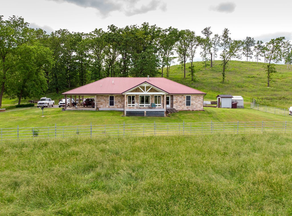 Beautiful 158 acre farm w/ custom built 2,100 sqft home that offers an amazing view. Secluded & only a short drive to the conveniences of town. Home well thought out with oversized rooms & doors, 2 large bedrooms with private baths, oversized living room, kitchen & dining room. Bonus room for office, crafts or 3rd bedroom, separate 3rd full bath. This home has so much to offer, home is equipped w/ outside wood burning furnace or central heat, partial home generator, fireplace, too much to list.