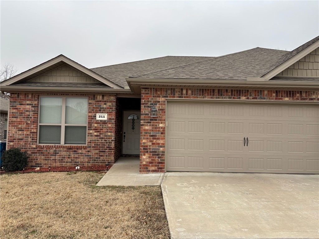 Spacious 3 bed 2 bath home in central Pea Ridge just minutes from Bentonville and Rogers. This open floor plan features hardwood tile throughout the common areas and in the kitchen enjoy granite counters and stainless steel appliances including the fridge. This home also features large carpeted bedrooms and in the master bathroom you will find plenty of storage and counter top space with dual sinks and a large walk in shower. Also included with this home is a Washer and Dryer! Outback lounge or BBQ on the spacious covered patio that opens up to a level spacious yard. Lawn care and landscaping is included. Yards are not fenced other than a divider fence between units. Pets are allowed with an additional $250 per pet refundable deposit and additional pet rent.