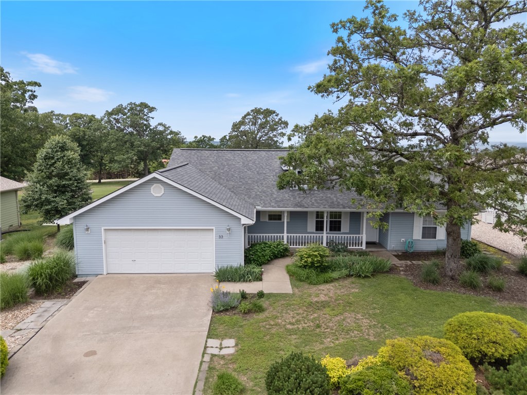 This immaculate 3 bed, 2 bath, 1,570 sq ft ranch-style home sits on the 18th fairway of the Holiday Island Championship Golf Course offering panoramic views. With an open, flowing floor plan, the home exudes a vacation resort feel, filled with abundant natural light and breathtaking views from every room. A stunning white kitchen showcases Silestone countertops, ample gathering space at the peninsula, and a spacious dining areaāperfect for entertaining. Vaulted ceilings and a cozy pellet-burning woodstove add warmth and character to the living room. The master suite is a true retreat with golf course views, private deck access, a luxurious en suite bath with barn doors, double vanity, built-in cabinetry, & a spacious walk-in closet. Step onto the covered porch to enjoy the fully landscaped yard & scenery. The garage includes a multifunctional workbench, storage, golf cart entrance, & handicap-accessible ramp. Also includes home generator. Walk to the country club, shops, & enjoy all of Holiday Islandās amenities.