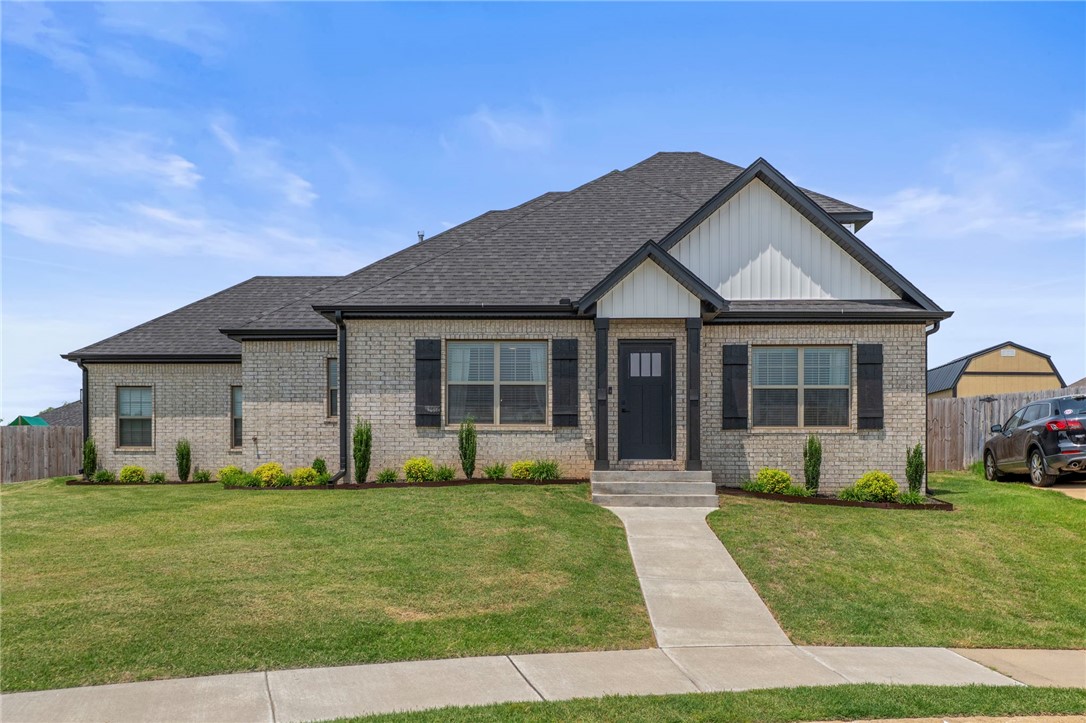 This home is perfect for anyone!! Sitting on one of the best lots in the s/d, Beautifully designed, meticulously maintained, and in the HEART of NWA! On the main level, you will be greeted by beautiful wood floors that extend through the main living, kitchen, dining area, and Master bedroom. Spacious living room open to the gorgeous kitchen with soaring custom cabinets, gas cooktop range, stainless appliances, granite countertops, and a fabulous large island with seating. Enjoy the lovely dining area off the kitchen as a casual dining, or a great entertaining space. You & Your guests have easy access to the 1/2 bath just off the kitchen, and Everyone will appreciate the enormous laundry room located off the garage entrance. Upstairs, you will find 2 nicely-sized bedrooms that are serviced by a full bathroom. Lots of storage space/closets in this home! You have a beautiful space inside & OUTSIDE! Fantastic Pergula w/ sun-shades to enjoy the beautiful landscaped yard and tranquil place to relax or entertain!