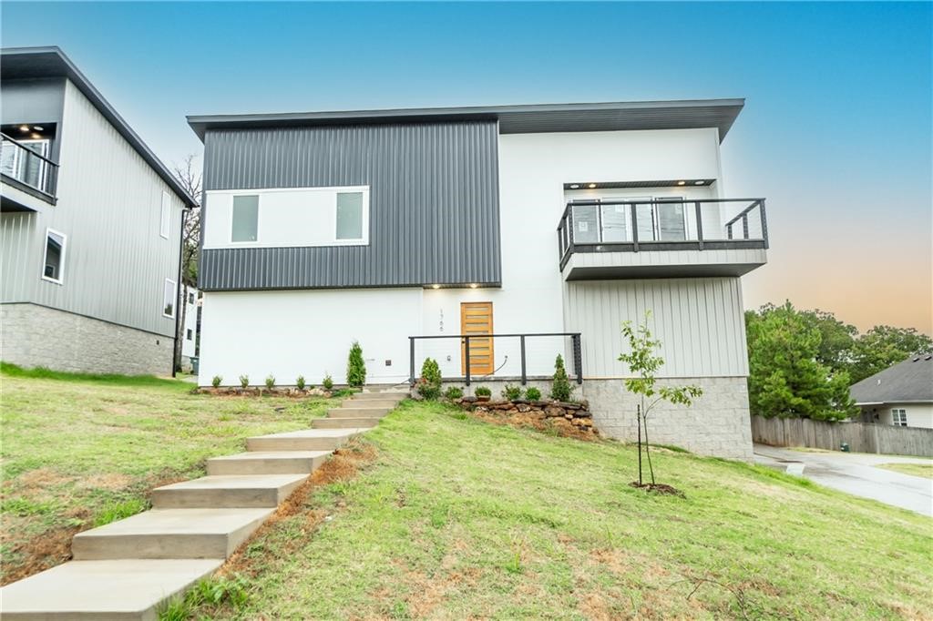 No expense spared on this modern, yet contemporary, new construction in Fayetteville! Stunning roof top views you will fall in love with of South Fayetteville! Enjoy amenities such as a 2 car garage , custom landscaped front yard and gas fireplace in living area! Inside, this home boasts an excellent open layout with engineered hardwood throughout the main living to the kitchen and eat-in area. Kitchen has quartz countertops, stainless steel appliances, and built-in pantry. Home has bar area with a wine fridge. Master bedroom is a calming retreat with amazing views, a beautiful bathroom with a walk in shower, and double vanity. Large walk in closets, wood is throughout the entire house except carpet in 2 downstairs guest bedrooms and laundry hook ups. This home is set among the trees, bringing the outside in through low efficiency vinyl windows! You wonāt want to miss this amazing home! Builders offers 5k concession.