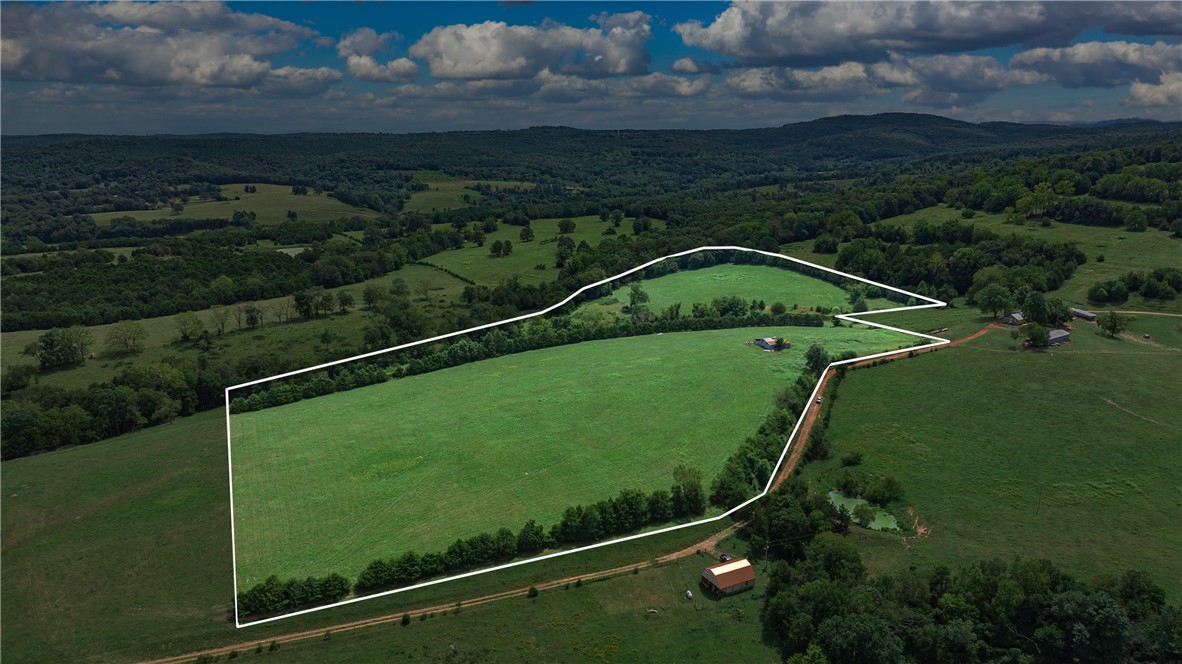 Discover the charm of country living on this idyllic 26-acre tract located amongst the rolling hills of Madison County. Currently used for hay, the land offers both functionality and breathtaking scenery. A spring-fed pond provides a serene centerpiece as well as a water source for livestock or wildlife.
The property also includes a hay barn. With its gently rolling terrain, open fields, and peaceful setting, this acreage is perfect for a small farm, ag use, or simply enjoying as a private retreat. Perc test and survey available
If youāve been dreaming of wide-open spaces and a slice of Ozark paradise, this property is ready to welcome you.