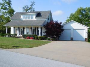 Fantastic custom built open concept home on 1 ac on quiet dead end street in lovely neighborhood. Low maintenance Hardiplank siding and brick, wonderful full length covered deck overlooking the 15x30 pool, oversized garage, plus a 960 sq. ft. heated & cooled shop with 1/2 BA. Upstairs BR could be converted to 2BR. Gorgeous hardwood floors. You must see this one! See supplement for more.