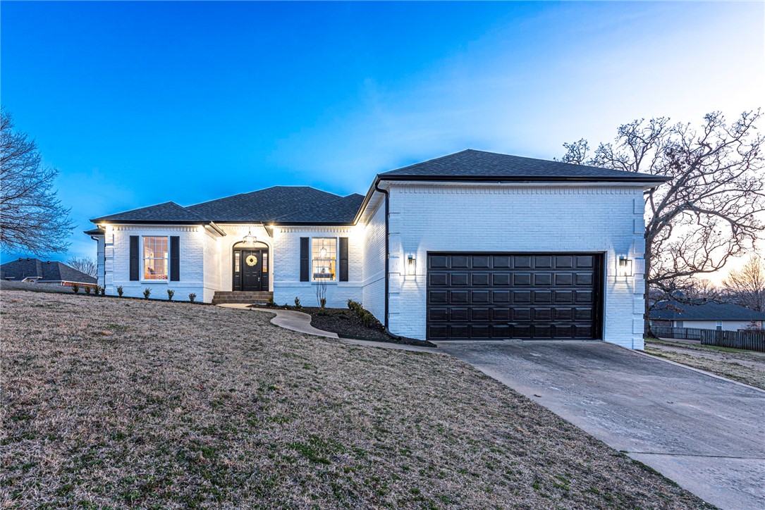 WELCOME! This UPDATED 3 bedrm 2 bathrm home has a location min away from I-49, schools, shopping, & more! From the updated white & black exterior head inside this home made for hosting! With updates that include luxury vinyl plank flring & updated lighting this home is what you have been searching for! Entertain in the living room w/ fireplace & openings that make it feel like an open concept perfect for sharing lots of natural light & a formal dining with crown molding details! In the kitchen with amble cabinetry & room for a coffee bar w/ open shelving & updated backsplash, stainless steel appliances, & counter space! + an eat-in dining space! Rejuvenate in the oversized primary bedrm w/ patio access & ensuite feat: a two separate vanities, corner whirlpool tub, walk in frameless shower, & a walk-in closet! + 2 more bedrms & 1 pass-through bathrm! Head out back & enjoy a covered back patio w/ large lawn perfect for the upcoming seasons! ADDITIONAL UPDATES: new paint, roof in 2023, & New HVAC! Donāt Miss Out!