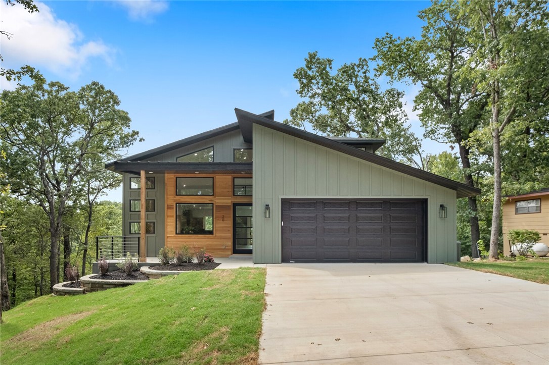 Welcome to this stunning modern new construction on a half-acre lot across from the Flo Ride Back Trail. This 4-bed, 2.5-bath, 2,495 sq ft home boasts high-end finishes, elegant details, and a thoughtful layout. Enter through the custom 8x4 ft solid wood door into an airy open floor plan with 20-ft ceilings and expansive picture windows framing breathtaking views. The chefās kitchen features custom white oak cabinetry, high-level granite, designer backsplash, and a massive walk-in pantry. Bedrooms offer walk-in closets; baths include warm white oak accents. Solid 8-ft wood doors, a white oak fireplace, and double HVAC systems add quality and comfort. The epoxy-coated garage with built-in storage enhances function. The backyard is ideal for gardening or entertaining. With outdoor recreation steps away, this property blends luxury, comfort, and convenience. Donāt miss your chance to own this one-of-a-kind modern masterpiece.