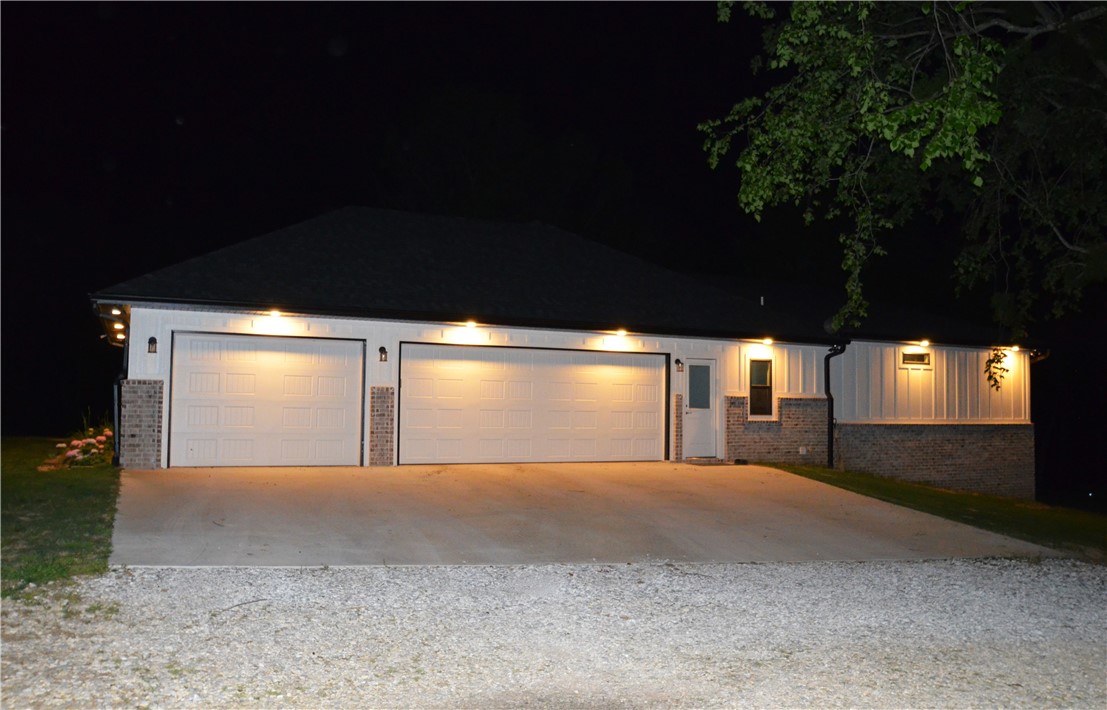 Welcome to your custom home on 5 acres built in 2024. Open floor plan for entertaining or just chilling at home. Sit on the expansive front porch to catch the sunrise or the large covered back porch to watch sunsets. Inside enjoy the chef's kitchen with a 48" Thermador gas range w/double electric ovens and griddle. The butler's pantry area is ideal for leaving your small appliances out and plugged in. Just around the corner is a 12x7 pantry. The custom cabinets have soft close. 2nd sink at built in bar area. Kitchen and living area have 10' ceilings. Large windows allow a view of the beautiful hardwoods and cleared areas out back including the garden area. Instant hot water. The 3 car garage is extra deep and wide with a full set of stairs leading to the storage area above garage. All exterior walls and the roof above home have spray foam insulation. The master closet/dressing room connects the expansive laundry room to the master bath which has a custom tiled shower.