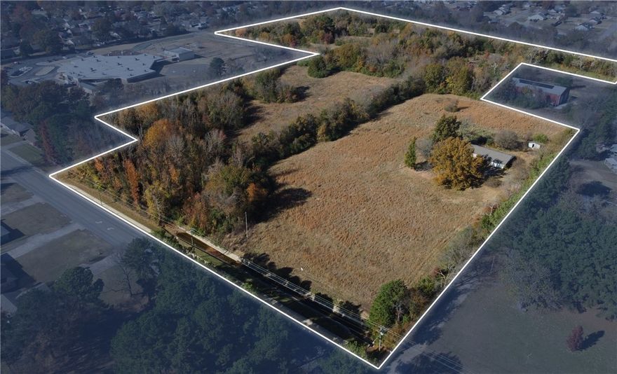 This 24.22-acre tract in Van Buren, Arkansas, is zoned R-1 (Residential), supporting a range of low-density housing options including single-family neighborhoods, large-lot subdivisions, or townhome-style developments. Rena Elementary School borders the property, an attribute that may appeal to households that prioritize close access to schools. The site is located just off Fayetteville Road and is minutes from I-40, providing direct regional access.
and connectivity to surrounding cities. Its acreage, transportation access, and
proximity to central Van Buren position it as a great option for future
residential development.