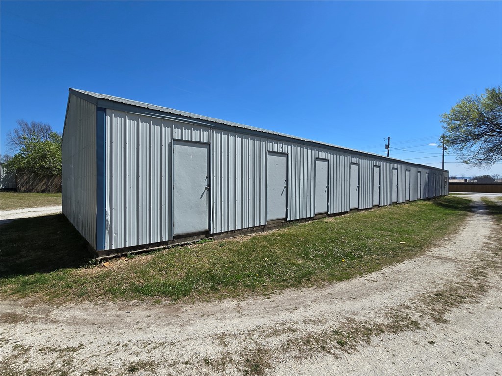 Interested in owning a mini-storage? Now's your chance! Over 1 AC +/- has a house, shop & a 22 unit mini-storage. Excellent location off Bethel Blacktop. Home has 3 BR, 2 BA, fireplace, large deck for entertaining & a huge yard. No city water. A well services the entire property. City water at street. Gas to the home & shop. Shop is roughly 50x30. Shop has a heater & spot for wood stove. Separate electric meters. Storage units are 12x9 & have a nice size office with restroom. See MLS 1302738