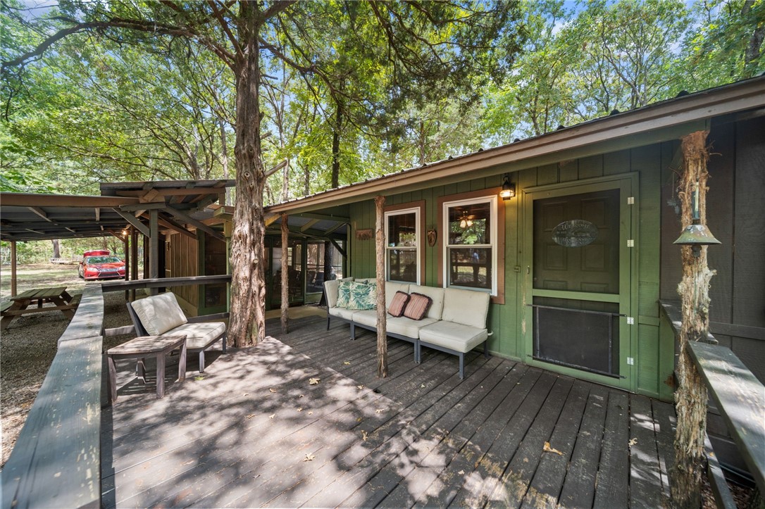 Welcome to Buckhorn Hideaway, a private retreat nestled on 6.51 acres, surrounded by the breathtaking beauty of the Ozark National Forest. This turn-key investment property features 4 fully furnished cabins and metal shop perfect for an AIRBNB property, hunting cabins or hosting friends who love all things outdoors. Your guest will enjoy 2 zip lines and a shooting range, offering endless opportunities for outdoor fun. Water tap at the street.
With convenient highway frontage, Buckhorn Hideaway is ideally located just 1.3 miles from Lee Creek and 3.2 miles from the Buckhorn trailhead, making it an outdoor enthusiast's dream. Experience the perfect blend of tranquility and adventure in this stunning setting surrounded by Ozark National Forrest.