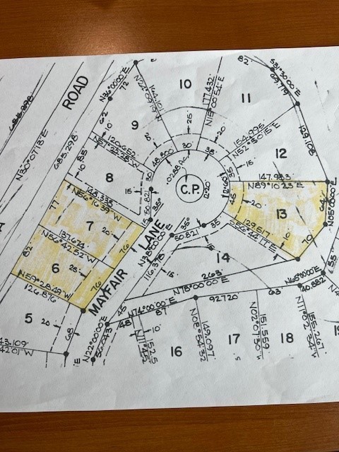 Buildable, .24 acre, cul-de-sac lot in beautiful Bella Vista! This great lot is near everything and only a 5 minute drive to 71 Biz. Close to Lake Windsor, Lake Avalon & Tanyard Creek Nature Trail & Bella Vista Country Club,all 5 minutes away. Only 2 minute ride to Huntley Gravity Zone mountain biking trailhead with access to many mountain bike trials such as: Rendezvous, Tango Whiskey, Up Hill Both Ways, Air Raid and Invasion! This lot is level in front and slopes slightly down to the north in back. Electric is at the street. Lot is perced for septic, see attachments for letter and new survey. 1200 s.f. minimum, There is an adjacent lot also for sale, Lot 7 .25 acres which combined would be .51 acre lot. There is an additional lot 13, .29 acres also for sale, across the street in the cul-de-sac. Hurry to see these fantastic buildable lots!