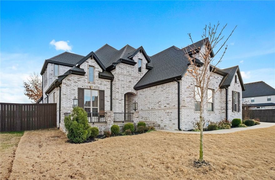 Welcome to Lochmoor Club. One of Bentonville’s most desirable neighborhoods where community, convenience and adventure meet. This Phase 2 home sits on a rare 0.33-acre lot (larger for the development) and backs directly to the Bentonville Greenway. That means you can hop on your bike and reach all the incredible trail-connected destinations that make NWA so special- safely and easily from your backyard. A 3-car garage provides space for bikes, gear. Inside: soaring ceilings, 10’ doors on the main level, triple crown molding throughout the main-level common areas. Open kitchen with ceiling-height cabinetry, quartz countertops, and gas cooktop, flowing into living and dining spaces. Main level includes 4 bedrooms and 3 full baths, with the 4th bedroom set up as an office. Upstairs is a large bonus room with storage closet and half bath. Covered patio features fireplace and remote-controlled mechanical screens. Amenities include pool, baby pool & spa, tennis, basketball, volleyball, playground, pavilion & green space.