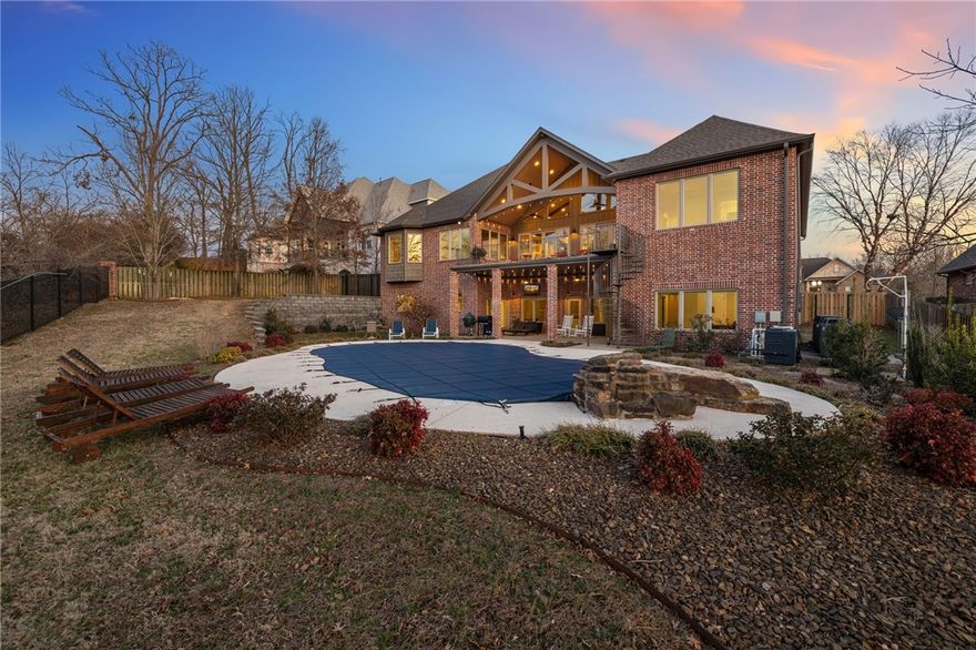 THE ULTIMATE RETREAT – DESIGNED FOR LUXURY & FUNCTION! This stunning home is designed for comfort and entertainment, featuring a saltwater pool, chef’s kitchen with 6-burner cooktop, double ovens, large prep island, and pantry. The main level offers two primary suites, guest bedroom, media room, butler’s pantry with workspace, serving bar, and a laundry room with pet shower.  

The lower level is built for fun with a bar area, second media room, two bedrooms, two baths, office, safe room, and seamless indoor-outdoor living. A new outdoor changing area makes pool days effortless. 

Enjoy 2,194 SF of heated/cooled flex space, new roof (July 2024), fresh interior paint, newly polished concrete floors, and motorized shades on all four patio doors for privacy and light control. A truly one-of-a-kind retreat!