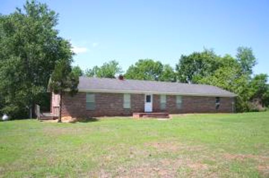 Rare find in the county on 22 acres. Large brick home with 2 full living quarters. The upper level offers large living room, large custom kitchen with island, dining area, 3 BR 2 full BA. The lower level offers kitchen, living room, 2 BR 1.5 BA and utility room. The home also has a large deck that overlooks the property. 2 car garage with room ready for woodworking or storing your tools. The possibilities are endless. A lot of house for the money, priced for you to upgrade as you wish. Land is ready for cattle or horses, just add fencing.