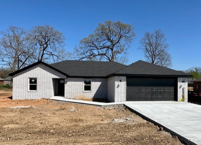 Gorgeous home built by a custom home builder with an eye for detail!! 1708 sq ft with 4 bedroom and 2 baths. Lots of extras including full brick, granite, fireplace, walk in closets, spacious covered patio, on a hard to find extra large lot. Perfect open floor plan in this adorable small town. The school is on the same street! Don't miss the opportunity to own this new home!