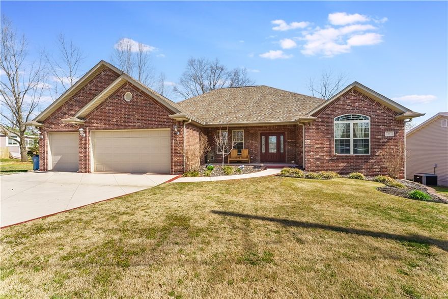 Located next to  Bella Vistas most  famous biking trails, this home offers 4 bedrooms and 2 full bathrooms, providing 2,321 square feet of living space. The property features an eat-in kitchen, formal dining room, and a living room highlighted by elegant pillars, strand bamboo flooring with custom inlays, vaulted ceilings, and a gas log fireplace. The kitchen is equipped with a pantry, pull-out drawers, and granite countertops. The master suite includes vaulted tray ceilings, dual closets, a whirlpool tub, and a walk-in shower. Additional amenities encompass an epoxy-floored 3-car garage and a deck overlooking the backyard and green space. This home also has an Airbnb Permit through the city. ***SELLER IS OFFERING $10,000 TOWARDS HOME IMPROVEMENTS***