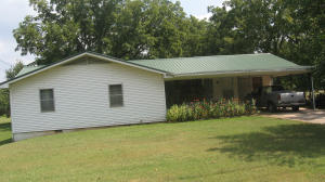 HIGHWAY FRONTAGE PROPERTY, 5 ACRES AT EDGE OF TOWN,3 BEDROOMS, CARPORT PLUS GARAGE OR WORKSHOP 40 X 15, NEW CENTRAL HEAT/AIR IN 2014, YEAR ROUND SPRING FED CREEK(KROOKED CREEK).