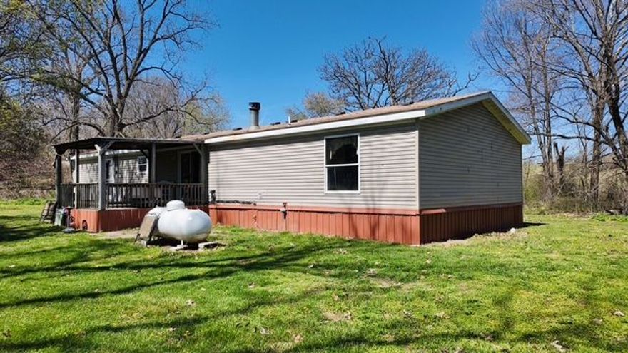 Two separate parcels being sold together. This 3-bedroom 2 bath home is nestled on 10 +/- beautiful acres in Oak Grove, offering the perfect blend of privacy and convenience. Enjoy peaceful country living while being just a short drive from Branson, Harrison and the NWA area. This home needs minimal work to become your ideal retreat or forever home. Recent updates include a brand-new heating and air system installed in 2026, adding comfort and value. Don't miss this opportunity to own a spacious property with endless potential.