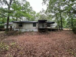 Mobile home on 1 acre wooded lot. Open living, dining and kitchen area. Must sign disclosure before entering property and return to listing agent before entering house. Needs repairs. ''The property is being sold in As-Is condition and without mobile home title.'' All offers must be submitted by the buyer's agent using the online offer management system. Access the system via the link below. A technology fee will apply to the buyer's broker upon consummation of a sale. Offer link to property: http://www.spsreo.com/?c=CG2W