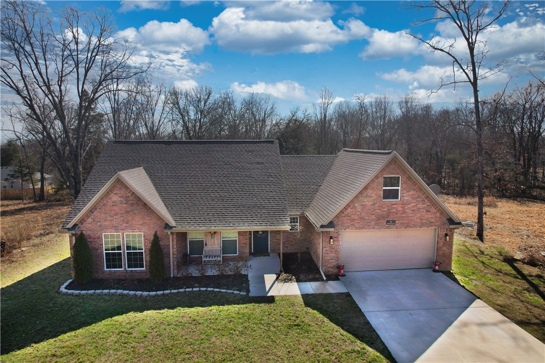 Custom built home! You will love the open floor plan with 3 bedrooms, 2 full baths on the main level, plus a bonus room on the 2nd level! The kitchen features granite countertops, gas range, microwave, dishwasher and TWO nice sized pantries! Enjoy the covered brick patio that overlooks your private backyard. Private location, yet close to Pea Ridge and Bentonville. Located in Bella Vista and zoned for desirable Pea Ridge School District. Book your private showing today!