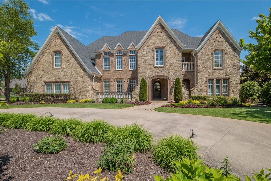 This exemplary estate is custom-built of incomparable quality located on the corner of a quiet cul-de-sac in the gated community of Pinnacle Country Club. The open floor plan was designed to offer ease in entertaining; with its open and airy public spaces; and also for quiet enjoyment with inviting private spaces to retreat to. The 5-bed, 6.5 bath, spans two stories with the master suite and an additional guest bedroom on the main level. Your guests will be impressed with the entertainment options within this home, from the home theater to the recreation room with a kitchenette to the fully equipped gym. The lush backyard features a saltwater pool with fountains, an outdoor kitchen, a covered lounge with a fireplace and an arbor courtyard enclosed by an ivy clad stone wall. This home has a four car garage and is located in Bentonville School District.
