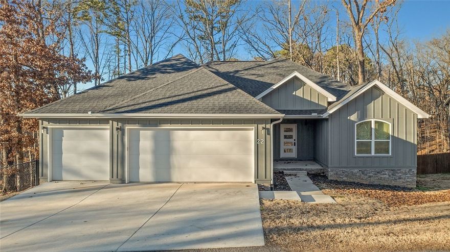 Beautiful four-bedroom home in the highly sought-after Bentonville School District! This home offers an open-concept living and kitchen area with a split floor plan for added privacy, granite countertops, a walk-in pantry, and wood and tile flooring throughout. The spacious primary suite features a walk-in shower and an oversized closet. Relax on the covered back porch or gather by the cozy fireplace on chilly evenings. A three-car garage provides ample storage. Situated on a sewered, fenced lot, this home includes a matching Frigidaire Gallery refrigerator, a seller-provided home warranty, and $5,000 in concessions with a full-price offer. Located in beautiful Bella Vista, AR, residents enjoy access to scenic lakes, golf courses, miles of biking and walking trails, parks, and a strong sense of community — all just minutes from shopping, dining, and the amenities of Bentonville.