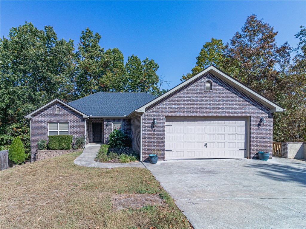 Beautiful Home located in Bella Vista, close to bike trails, Metfield Park, and much more! Custom features everywhere! Large living room, formal dining, and open kitchen with granite. Finished basement with bonus room that could be 5th bedroom! Hook up for hot tub, work room & safe room all extra features to make,it a winner! The multi-level, covered deck overlooks the private wooded backyard that is perfect for entertaining friends and family. With quick highway access, this residence checks all the boxes, Schedule your tour today! Seller offering $7500 credit to be used towards buyers closing costs or updates.