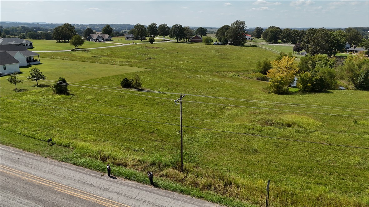 What an amazing opportunity to own the perfect blend of serenity and space on 1.4 acres, nestled in a prime rural neighborhood. The property is located on well-maintained, paved roads, just moments away from Hwy 65. The topography invites creativity to build your dream home, which could include a back porch view of wildlife around your corner of a shared pond.