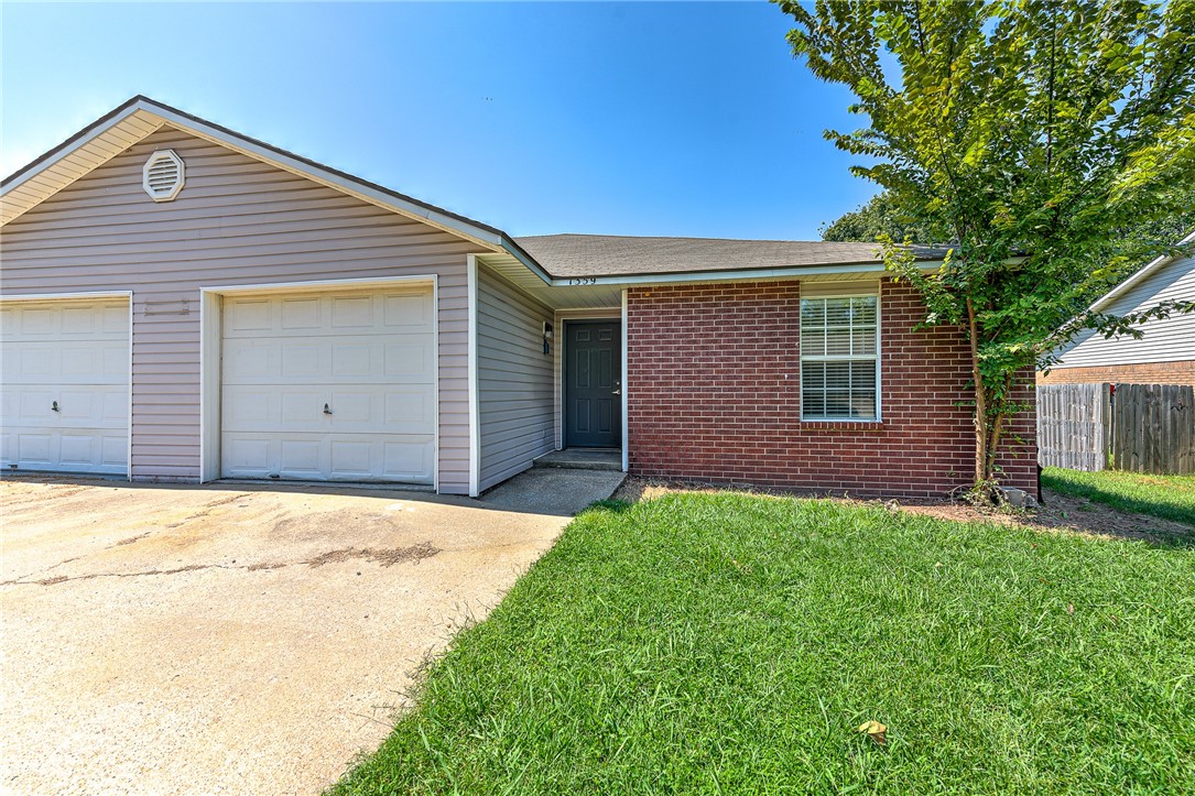 Perfect starter home or investment property in West Fayetteville! Freshly remodeled townhome (3 bedroom, 2 bathroom, 1 car garage per side) with new flooring, paint, counter tops, refinished cabinets, and new lighting & plumbing fixtures throughout. Brand new kitchen appliances including Refrigerator! Kitchen pantry and washer/dryer hookups, too. Conveniently located less than 2 miles from I-49 and only 3.5 miles to the UofA. Close to bus routes, schools, shopping, restaurants, and all amenities Fayetteville. Come see this property today! The unit next door, 1357 N Boxley Ave, is also for sale, see ML#1254296.