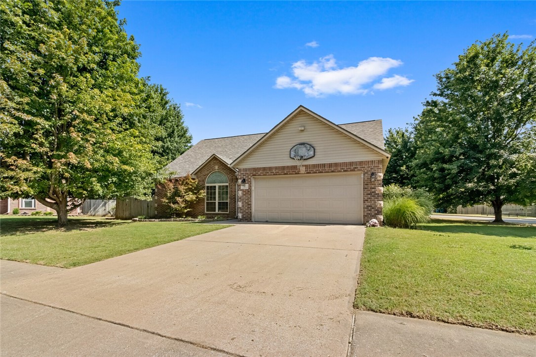 Beautiful, well maintained family home in the bustle of growing Bentonville. Just a couple minutes away from a Walmart Neighborhood Market, the Community Center, and lots of restaurants. Quiet neighborhood with sidewalks for walking and biking. Less than a 10 minute drive to each school. (Willowbrook Elem, Brightfield Middle, Fulbright Jr, & Bentonville High) -- This home features a split floor plan downstairs with a primary room/ bath (with 2 closets & a private water closet) and two bedrooms and a full bathroom. Upstairs has an extra living area, two more bedrooms and a full bath. This home is settled on a corner lot with beautiful mature maple trees. The backyard is privacy fenced and the storage building is to convey. It is a great space for kids to play or to create an oasis.*New roof in 2022, matching Samsung kitchen appliances (refrigerator to convey), tankless water heater, LED light fixtures*