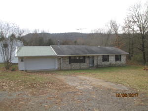 This property is eligible under Freddie Mac First Look Initiative through 12-26-17. No investors first 20 days. Brick 2 bedroom 2 bath home, 2-car garage, large sunroom on 2 acres. There is a detached workshop with an overhead 1 bedroom 1 bath apartment, 2 sheds, an RV shed..must see to appreciate! There is also a small stream that runs along the west boundary.