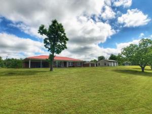 This lovely home on a hill has so many game changing features including almost 3 scenic acres for play, pets, or to just enjoy. There is a large shop for all your toys and hobbies, and a spacious home with storage everywhere, formal dining area, a roomy kitchen with tons of cabinets and a charming screened porch! There is so much to love about this classic Atkins home! Showing Agents See Private Remarks