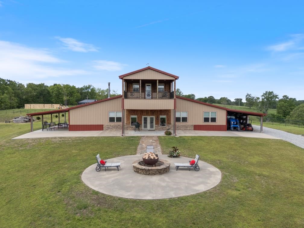 Welcome to your private retreat on 73.91± acres with War Eagle Creek frontage. This 3 bed, 2.5 bath home sits at the end of a paved road, offering peace, privacy, and stunning sunset views. Inside, warm woodwork flows throughout, creating a cozy, timeless feel. The spacious master suite includes a huge walk-in closet, and the covered back deck is perfect for relaxing or entertaining. Enjoy canoeing, fishing, or simply unwinding by the creek on your own land. Whether you’re looking for a family getaway, weekend retreat, or forever home, this unique property blends natural beauty with comfort and space to roam.