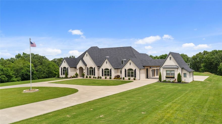 This gorgeous, picturesque 3848 sq ft custom home boasts 4 bedrooms, including a spacious primary bedroom suite w/private access to the back patio. The primary bath features a beautifully crafted custom double shower w/double body sprayers, double vanities,& a makeup application area. Closet space is abundant, w/a large walk-in closet, dressing room equipped w/custom cabinetry, jewelry holders, & more. The kitchen is an entertainer's dream, complete w/custom cabinetry & lighting, top-of-the-line appliances like a nugget ice maker & 6-burner gas stove, double WI-FI capable ovens, & 2 dishwashers. Additional features of this home include a breakfast nook w/pantry, formal dining room, a bright & spacious living room w/a floor-to ceiling custom entertainment center, & hardwood floors throughout living area & bedrooms. Outside, a wonderful back patio overlooks the expansive yard-perfect for relaxing or entertaining guests. The property includes a sprawling 4 car garage & is wired for future pool & hot tub. Agent Owned.