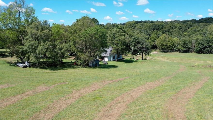 Beautiful 108 acres with old farmhouse waiting for you to open your cattle or horse farm or maybe invest for future development. The property has a drilled well and numerous springs with an abundance of water and multiple cleared pastures with breathtaking views. There is a 1200 square foot shop and an established garden near the home. Don't miss the opportunity to own one of the most beautiful properties in NWA.