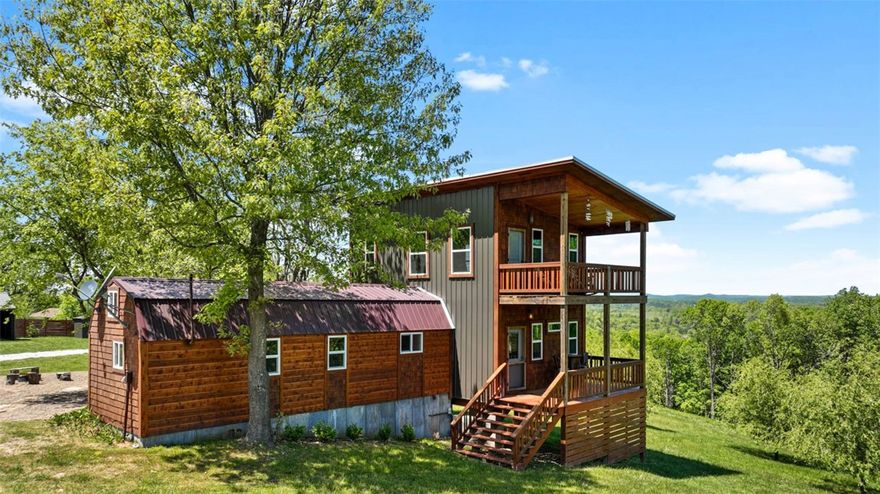 38 acres with 3 unforgettable AirBnb properties: 1100 sq ft. cabin and 2 geo-domes, plus outbuildings and unrestricted (perfect for hunting) acreage and only minutes to the Clifty boat ramp. In addition to the acreage and cabin, property offers boat and/or RV storage, a 2-story shop building (could convert to airbnb with basement) with extended shed roof, and large 32 x 40 building (next to cabin) with two covered lean-to’s. The modern but Rustic/Industrial cabin has gorgeous hardwood floors, concrete counter tops, vaulted ceiling and a sleeping loft plus 3 decks and an outdoor shower. 

The land has two other nightly rentals (Geo-domes with a view) on the property. The two other units are 500 feet away. Besides sharing the road to access the property there are no other shared amenities.
https://www.airbnb.com/users/show/23230292.  Scroll to see the 3 properties under "Mel's three listings"
Properties come fully furnished.  Turn Key AirBnb. Owner will transfer future airbnb bookings.