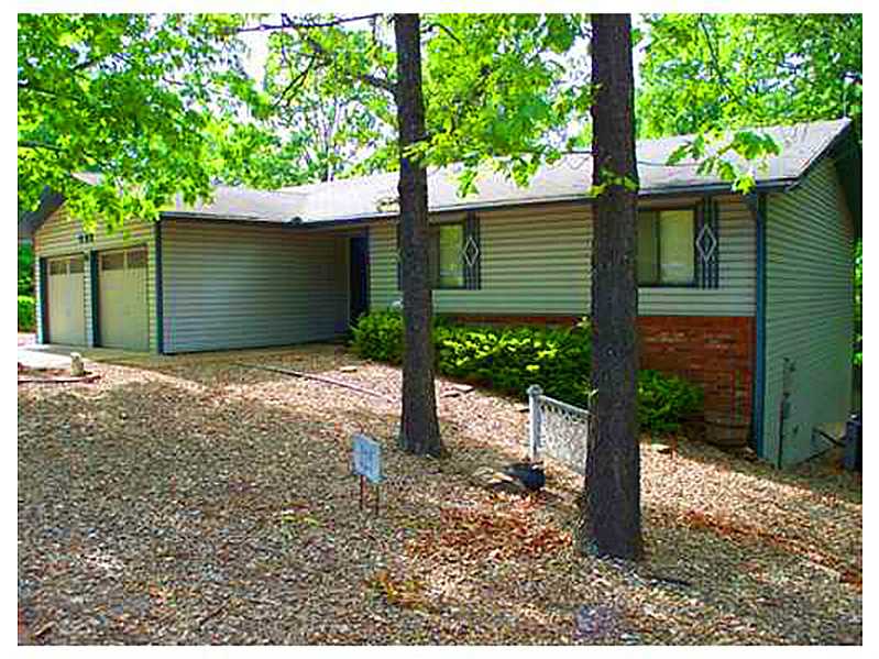 REALLY NICE 3 BEDROOM 2 BATH HOME WITH TWO LIVING AREAS, PLUS AN ATTACHED WORKSHOP, PLENTY OF STORAGE, SPACIOUS DECK, LARGE CORNER LOT, DETACHED STORAGE BUILDING, APPLIANCES INCLUDED, FIREPLACE, OPEN LAYOUT AND A 2 CAR GARAGE. CLOSE TO MO LINE AND HWY 71
