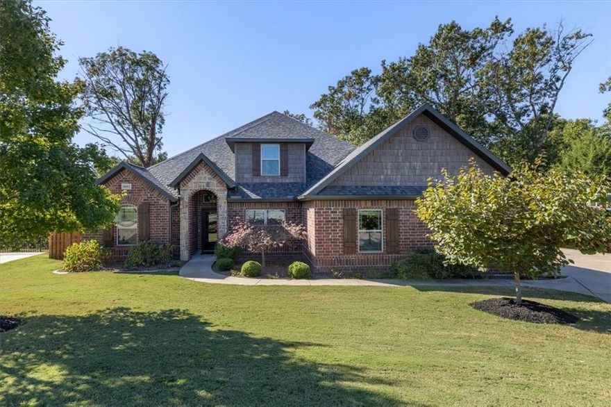 This is the one you have been waiting for! Fantastic Bentonville location with easy access to bike trails and I-49.  Beautiful .47-acre lot that with incredible outdoor spaces including covered & open decking, outdoor fireplace, firepit, play space, and privacy w/ surrounding trees/nature! Inside you will find ample upgrades including solid wood flooring, crown molding, double pantry, designer tiled fireplace, and more. Fabulous layout w/ 4 bedrooms on the main level, office/den with murphy bed, and a bonus room upstairs.