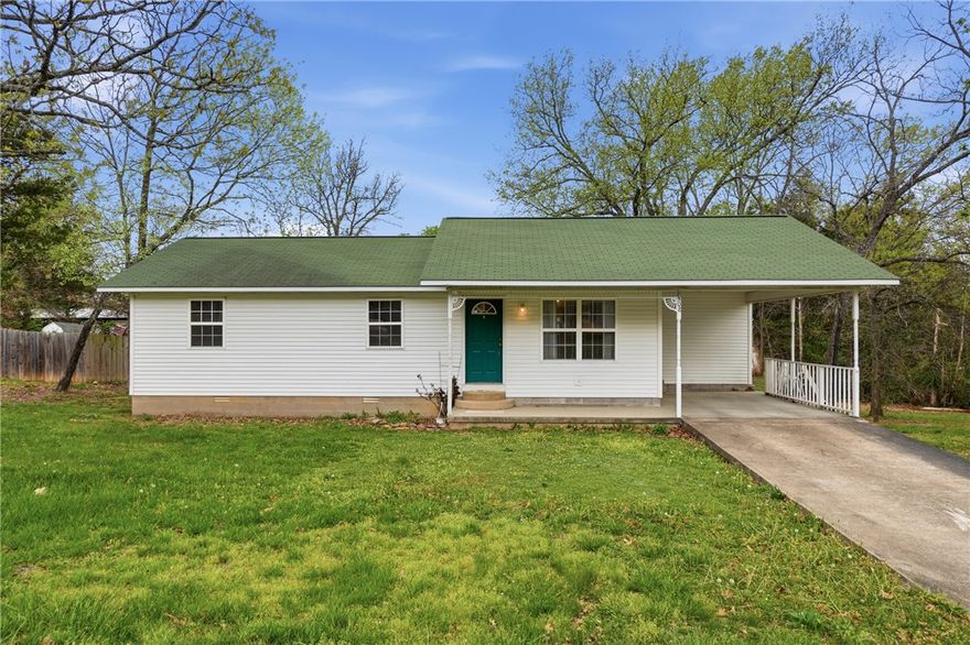 Discover comfort and convenience in this well-maintained home on a quiet street in Berryville. This inviting property features a bright, open living area with great natural light and a functional layout that maximizes every square foot. The kitchen offers ample cabinet space and an easy flow for everyday living or entertaining. Bedrooms are comfortably sized, and the home includes practical storage throughout. Enjoy the spacious yard with room for gardening, pets, or outdoor gatherings. A covered carport and additional parking add to the home’s appeal. Located close to schools, shopping, and local amenities, this property is ideal for anyone seeking a move-in-ready home in a friendly neighborhood. Whether you're a first-time buyer, downsizing, or looking for an investment, this home delivers value and comfort in a great location.