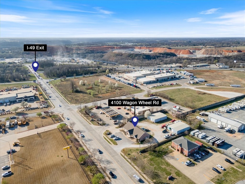 Commercial building and two warehouse right off I-49 Wagon Wheel exit.
Updated brick building with existing space for two separate tenants. However, could be converted to single occupant. Also behind the building sits two 2,400 sf metal warehouses. Perfect for a retailer needing a showroom along with storage for inventory.
Riser room, kitchen, workspace/mailing/copy room, individual offices, executive office adjacent to main conference room, lobby area, plus additional meeting and flex space.
Monument signage included.