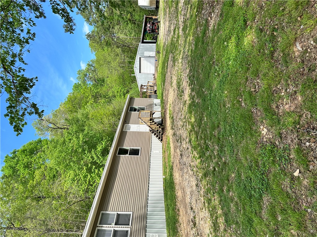 Home is on concrete footings and skirted. Large sh
