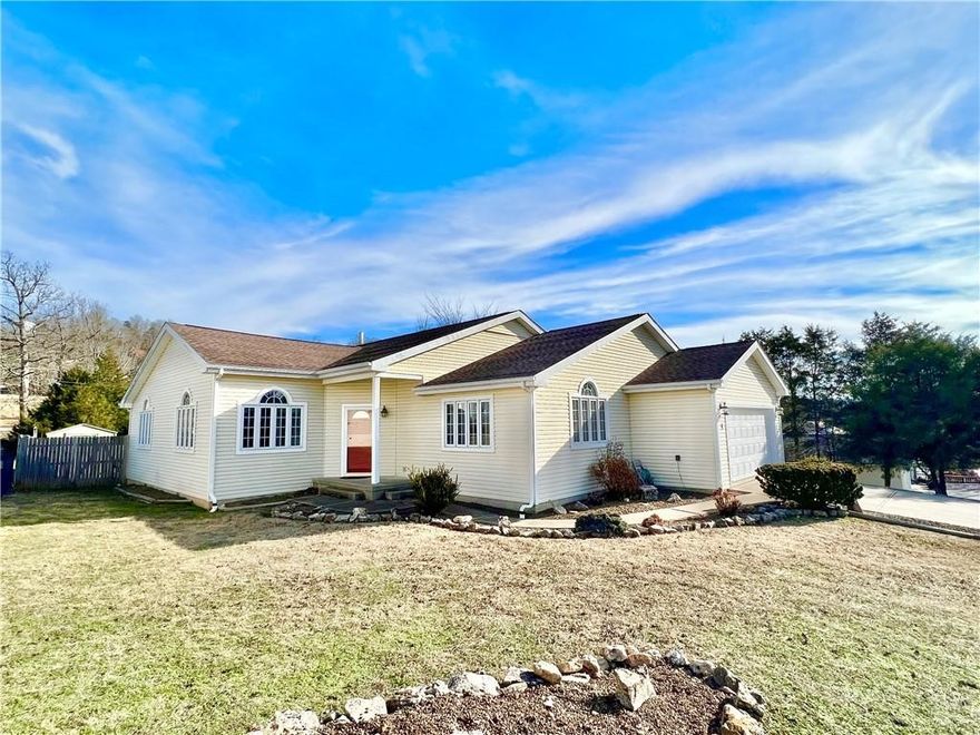 Holiday Island is a peaceful Vacation getaway for most and home to the lucky few. This beautiful well kept 3 bedroom 2 bath single level BnB has ample room for the whole family to spread out and enjoy their own spaces. There are two large living areas for entertaining family and friends while visiting the Oasis you have found here in the Ozark mountains. The large open floor plan has options for casual dining and a formal dining area too. The vaulted ceilings add to the spacious feeling this home offers. Whether you need all 3 bedrooms or just two and a nice home office, this home can meet all your needs. Two car attached garage has lots of extra storage. Large fenced in back yard is landscaped with a deck and screened in porch. Conveniently located adjacent to a beautiful golf course with stunning lake vistas, two community pools, tennis courts and playground area. You are also only 2 miles from the marina and moments from being able to be in the water on pristine Table Rock lake on your boat, jet skis or kayaks!