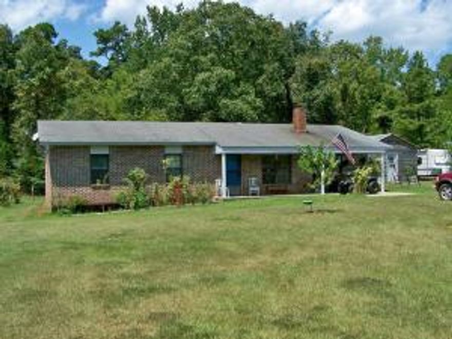 Country privacy at its best... 3 bedroom 1 bath home on 11.98 acres with a pond, barn and a 16 x 30 extra building complete with electric and window units to cool. This cozy home comes with all the appliances including the washer and dryer. There is also a pond.