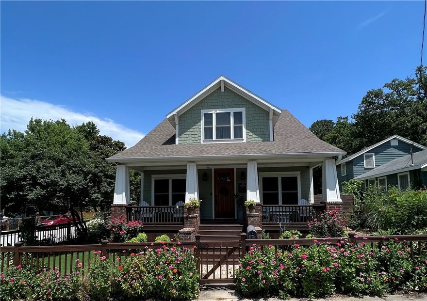 Don't miss out on the opportunity to live in your very own downtown Fayetteville sanctuary! Walking distance to the Fayetteville Public Library, Downtown Square, and many walking/biking trails. This exquisite home, nestled on a corner lot with stunning landscaping, is the perfect retreat. With its craftsman style and charming double hung windows, 8ft solid wood doors, and a spacious front porch, this home is truly a gem. Step inside to discover four spacious bedrooms, three full bathrooms, and two inviting living rooms. The open concept design seamlessly connects your front door to the dining room and kitchen, making entertaining a breeze. The kitchen and second living room are conveniently situated at the back of the house, providing easy access to the pool and covered back patio. Don't let this opportunity slip away - schedule your showing today and make this dream home yours!