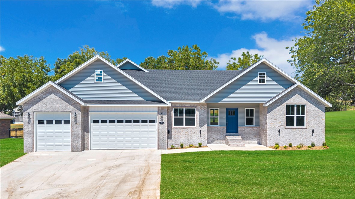 Welcome to this beautiful three-bedroom, two-bathroom new construction home on the perfect oversized lot in Holiday Island. Walk into the open concept house you've been looking for with modern white kitchen cabinets, a contrast kitchen island, and sparkling white quartz countertops. The master bath has a walk-in closet, a beautiful custom tile shower, and a freestanding tub to relax in after a long day. Enjoy the peaceful views of table rock lake, relax out on the back patio, cozy up in the winter by the fireplace, or take the short drive to Eureka for shopping, dining, and entertainment. This home is located just minutes from the holiday island amenities such as the golf course, tennis courts, clubhouse and Holiday Island Marina. Listing agent related to seller.